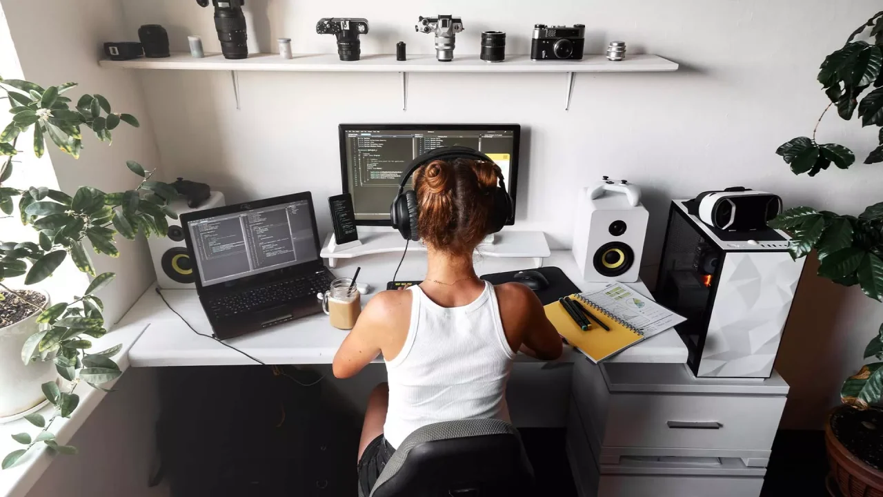 A person working at their desktop computer with Windows running.