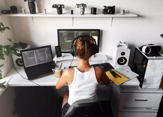 A person working at their desktop computer with Windows running.