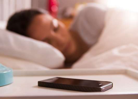 woman sleeping by a phone