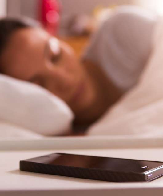 woman sleeping by a phone