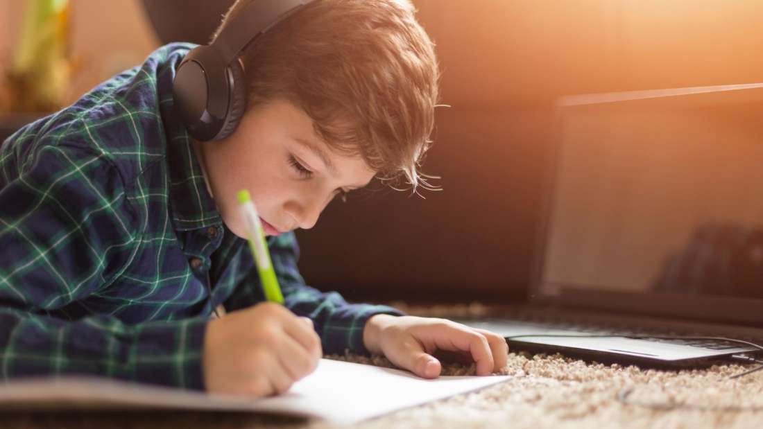 Young-boy-studying-with-tablet-at-home