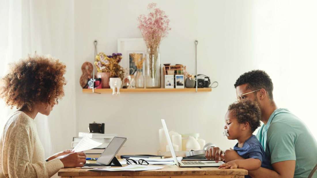 mother-father-and-son-on-computer-at-table