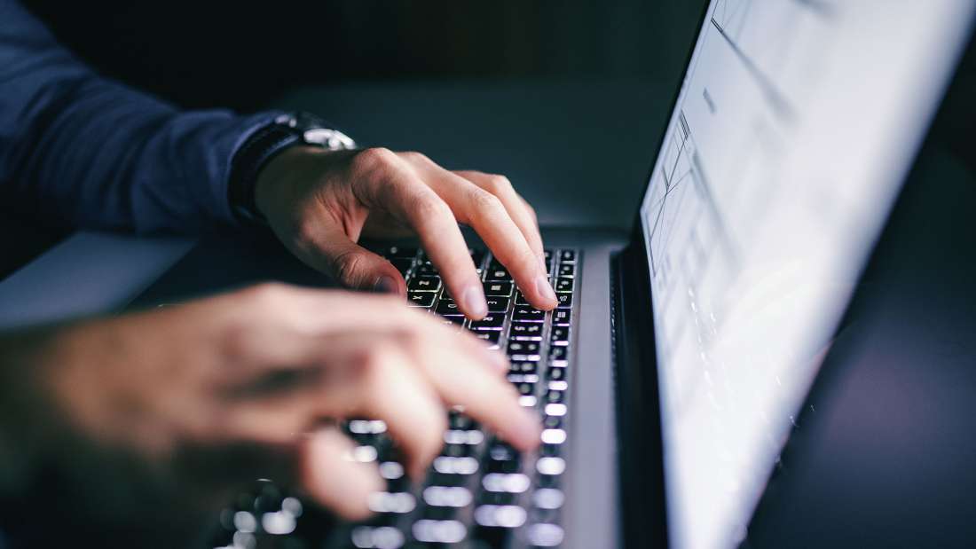 hands-typing-on-laptop-keyboard