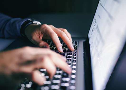 hands-typing-on-laptop-keyboard