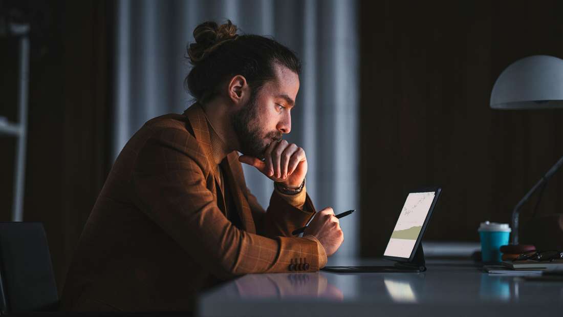 Man looking at tablet