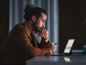 Man looking at tablet