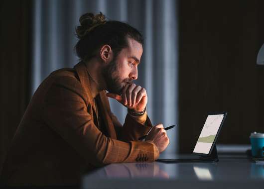 Man looking at tablet