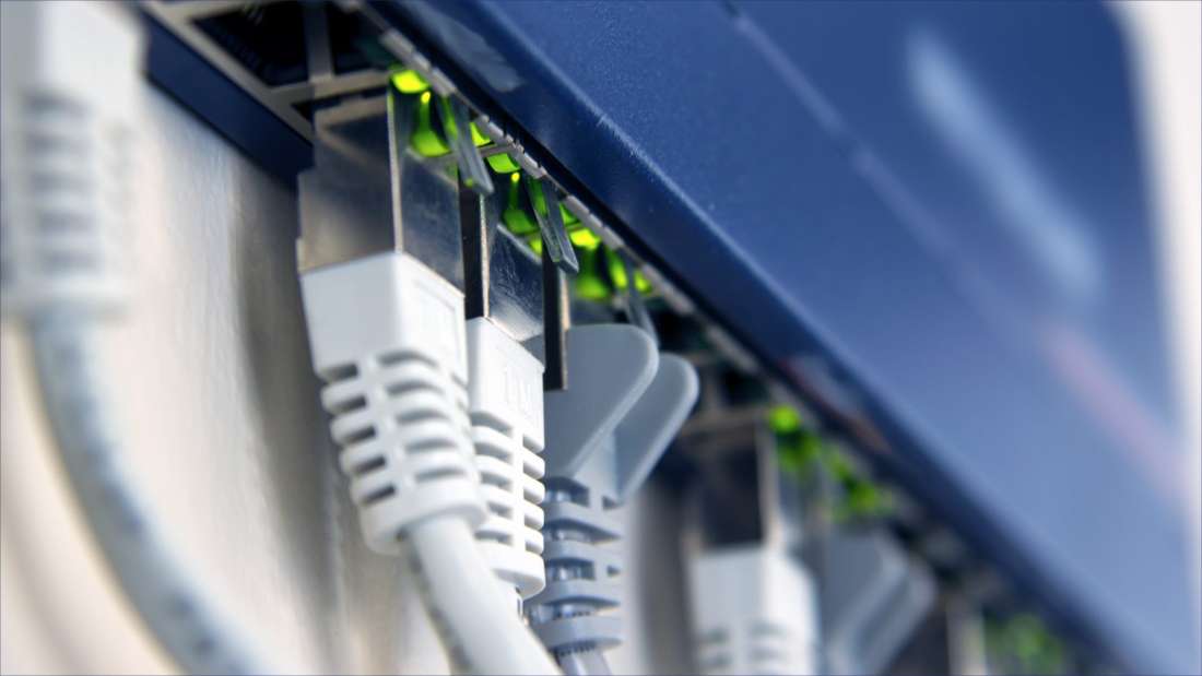 Close-up shot of cords connecting to a router.