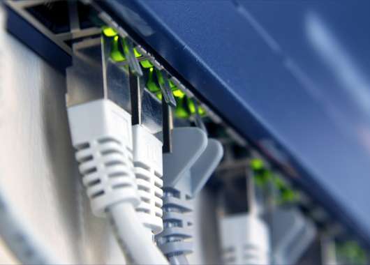 Close-up shot of cords connecting to a router.