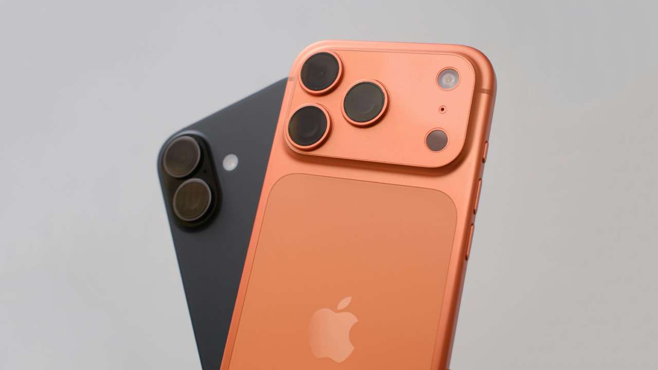Photo of two iPhone 17s in black and orange colors.