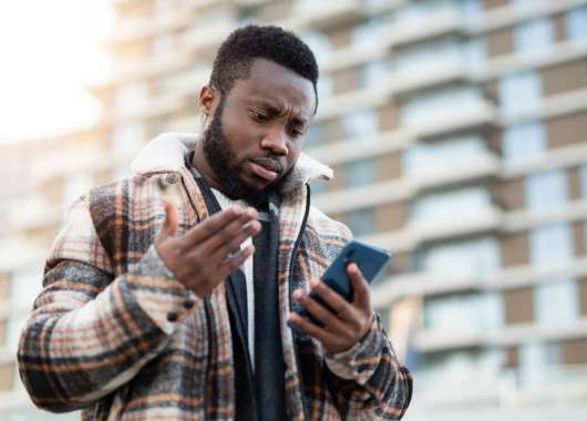 A man looking down at his phone.