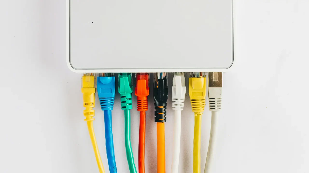 A router with multiple connections coming out of it, an example of how to set up a secure home network.