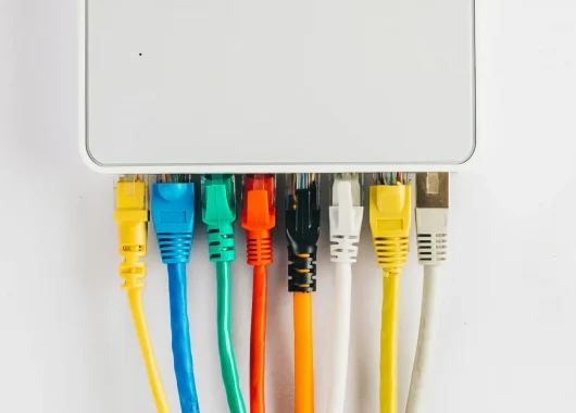 A router with multiple connections coming out of it, an example of how to set up a secure home network.