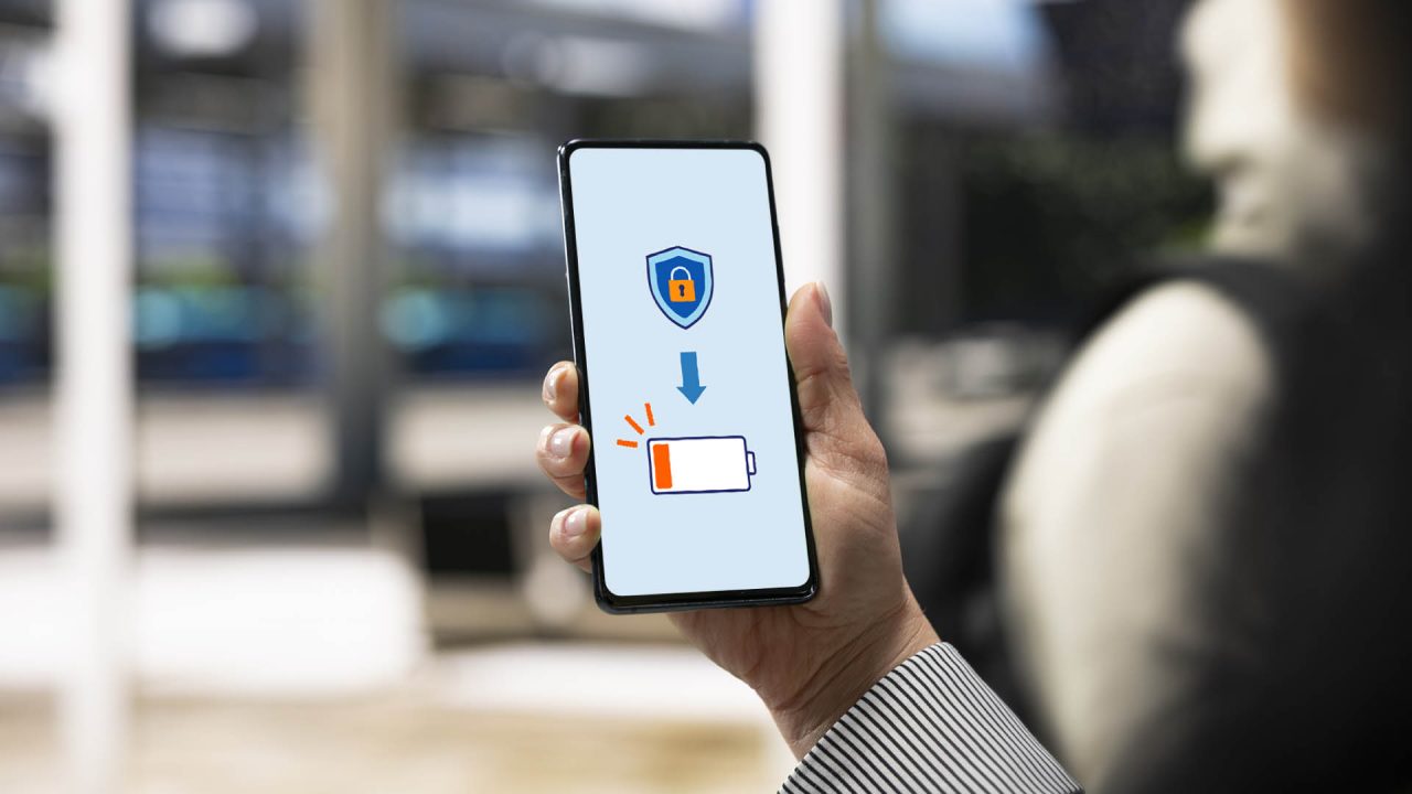 A person holding a cellphone up with a lock symbol and low battery sign.