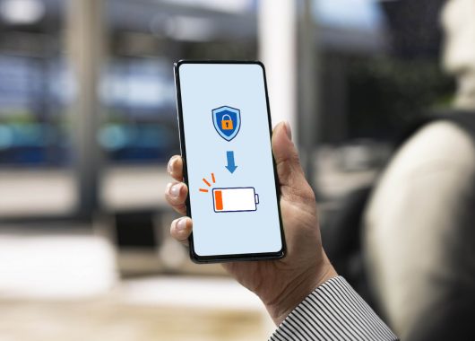 A person holding a cellphone up with a lock symbol and low battery sign.