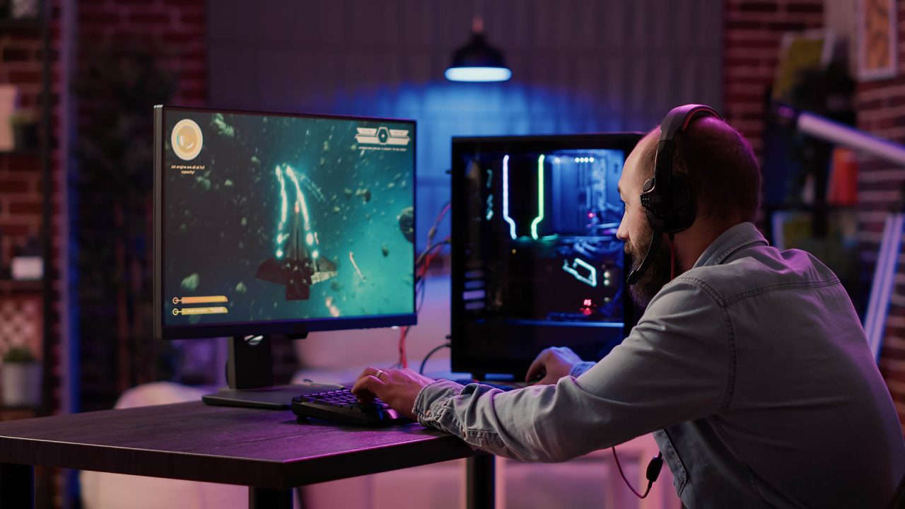 Gamer playing on a monitor with a secure VPN connection icon overlay
